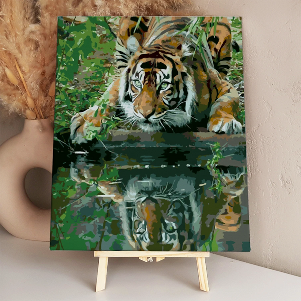 Stylized painting of a tiger crouching by water with reflection